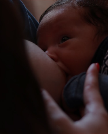 Baby being breastfed.